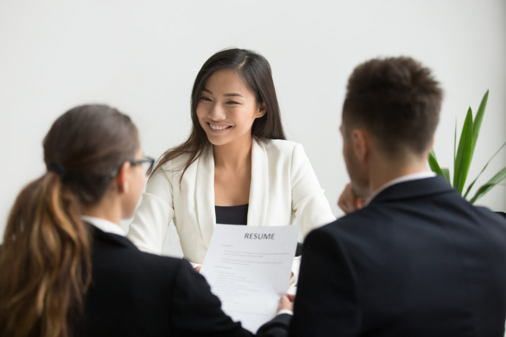 asian woman asking interview questions