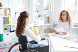 woman in a wheelchair answering common interview questions